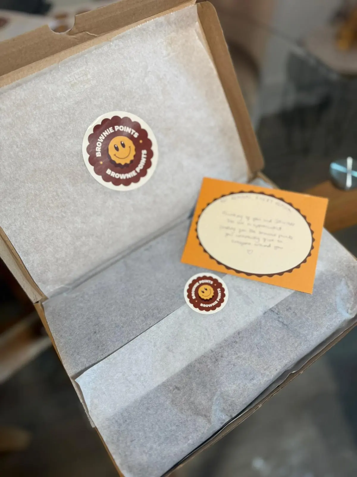A Brownie Points box with a handwritten message card