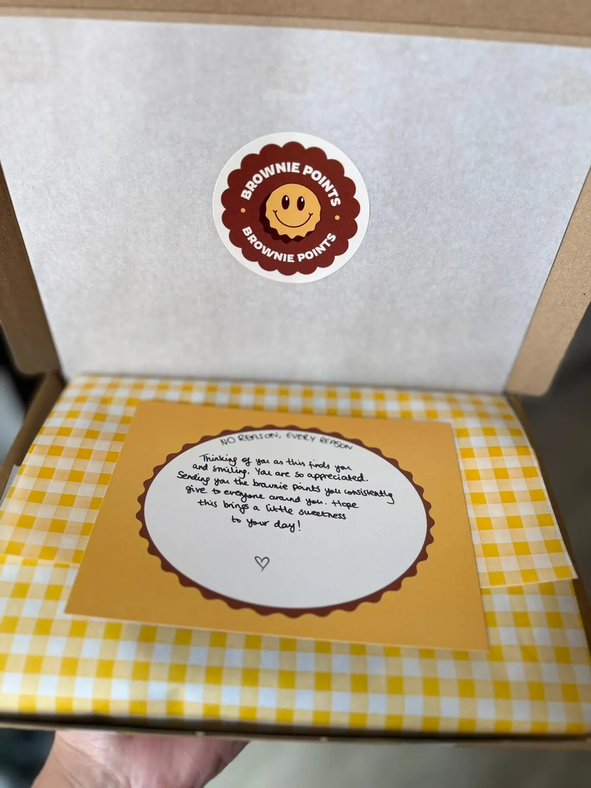 A Brownie Points box with a handwritten message card
